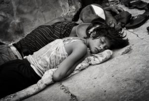 Homeless teens on the sidewalk sleeping